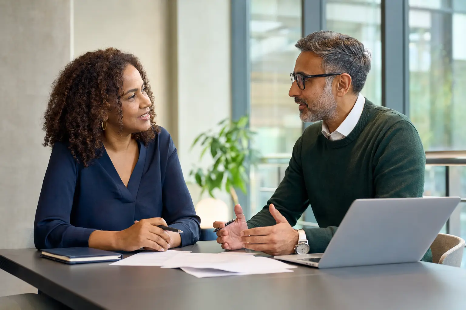 A mature learner discussing university options with an education adviser